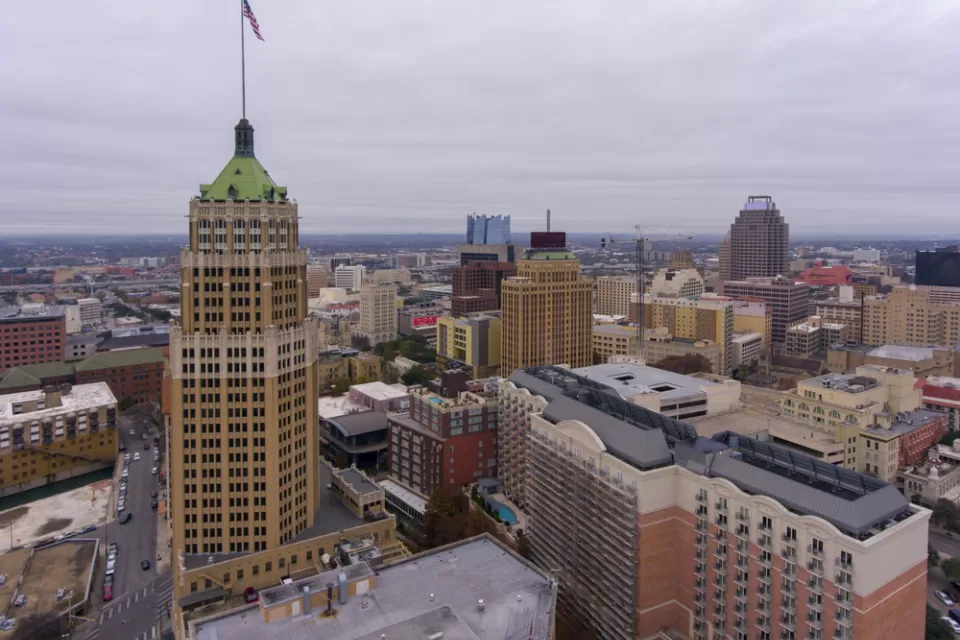Aerial view of downtown San Antonio with Tower Life Building in foreground